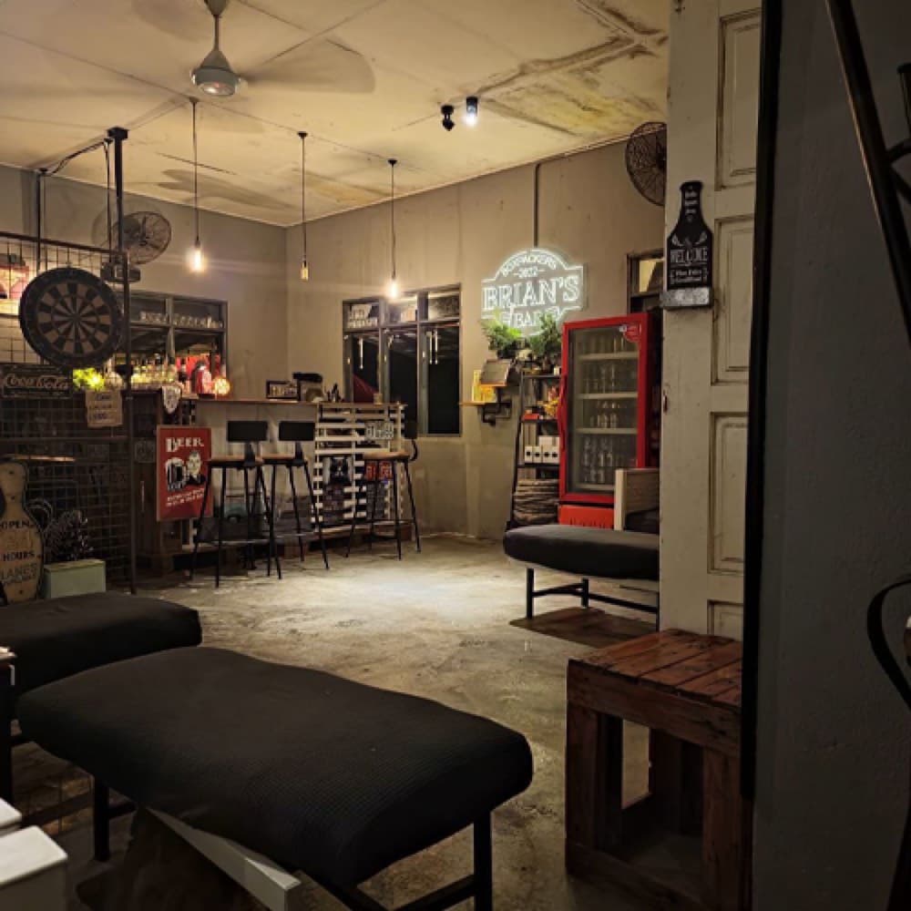 Inside the bar, with the neon sign and the back bar
